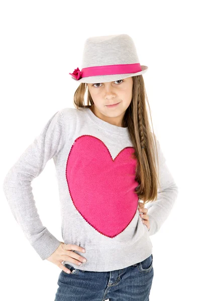 Cute young girl model posing in gray hat with hands on hips — Stock Photo, Image