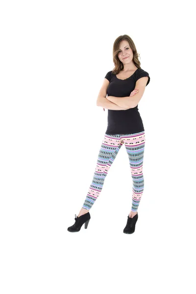 Modelo feminino confiante vestindo leggings apertados coloridos e preto — Fotografia de Stock