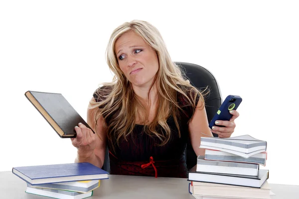 Attractive female model ignoring homework distracted by cellphon — Stock Photo, Image