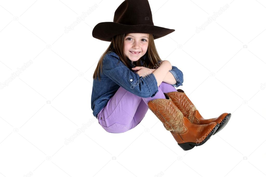 cute cowgirl with a big smile and missing front teeth