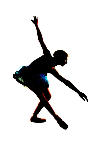 Silhouette of a young ballerina stretching bending over — Stock Photo, Image