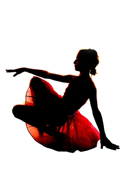 Sylwetki baleriny bilansowania w tutu czerwony — Zdjęcie stockowe