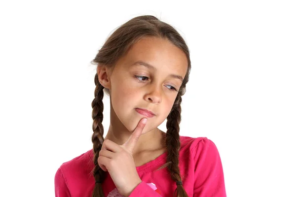 Chica joven pensando con el dedo en la barbilla — Foto de Stock