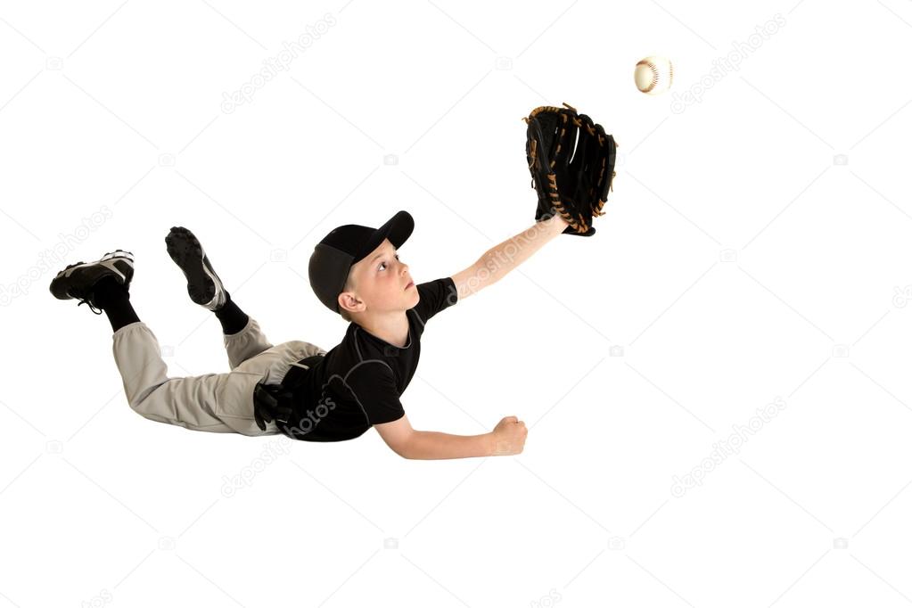 young baseball player diving to make an awesome catch