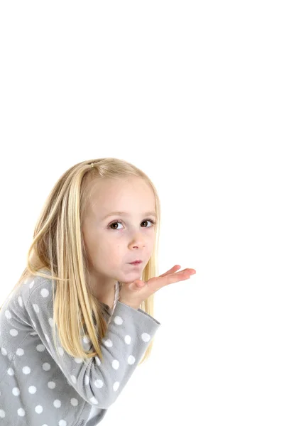 Cute young blond brown eyed girl blowing a kiss — Stock Photo, Image