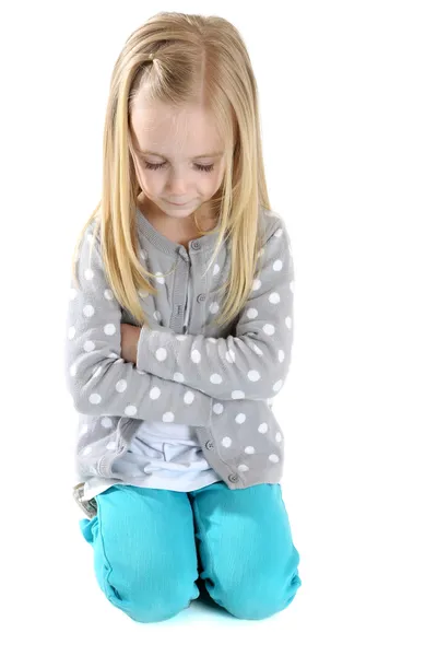 Cute girl kneeling down arms folded eyes closed to pray — Stock Photo, Image