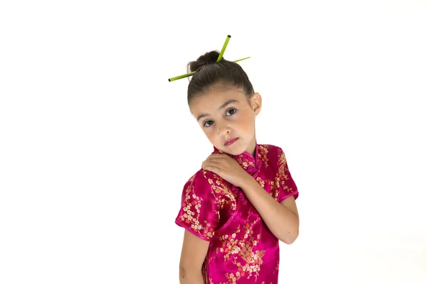 Shy young girl wearing a Chinese cheongsan dress — Stock Photo, Image