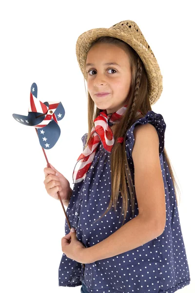 Beautiful young girl holding a patriotic windmill — Stock Photo, Image