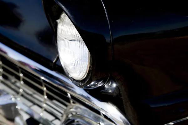 Sixties classic black car front end close up — Stock Photo, Image