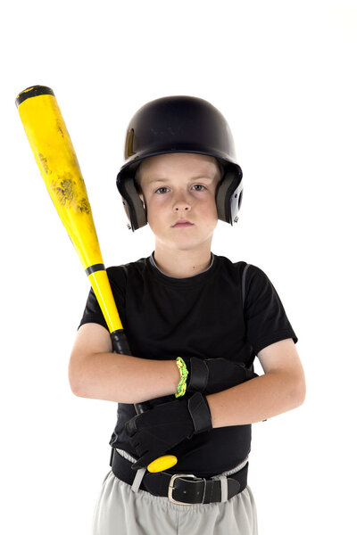 Small boy holding his baseball bat with a serious expression