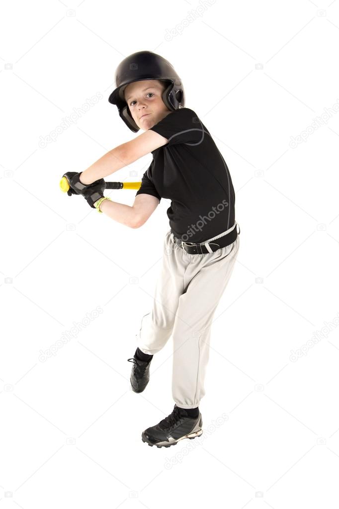 young baseball player swinging bat with eyes open