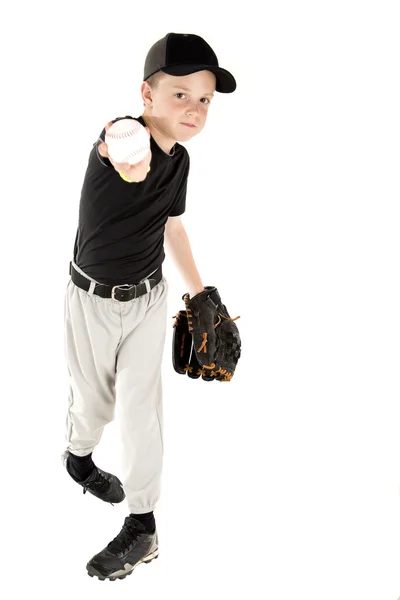 Young baseball player throwing the ball into the camera — Stock Photo, Image