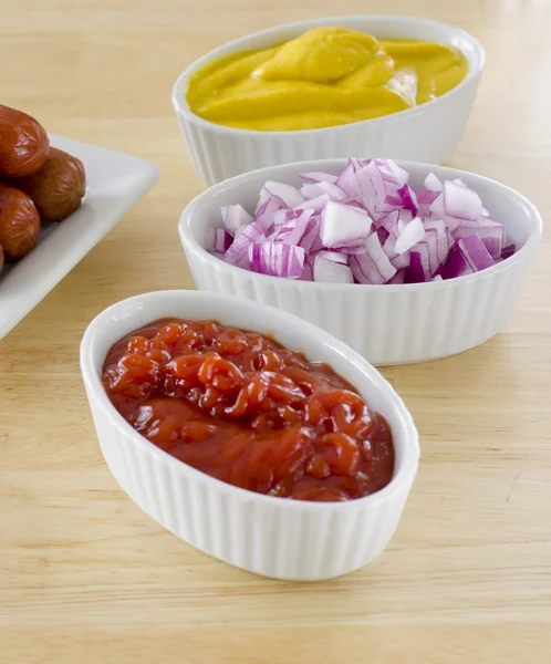 Condiments ketchup onion and mustard — Stock Photo, Image