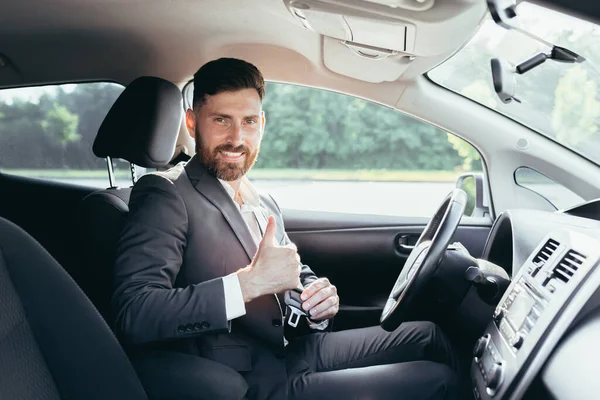 Businessman Shows Thumbs Looks Camera Smile Urges Pinch Use Seat — Stock Photo, Image