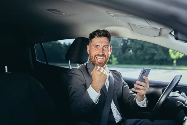 Male Businessman Successful Rejoices Smiles Reads News Mobile Phone Win — Stock Photo, Image
