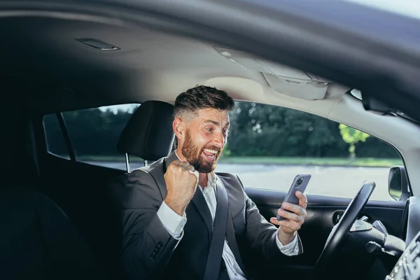 Excited Emotional Adult Businessman Driving Car Rejoicing Online Victory Achievement — Stock Photo, Image