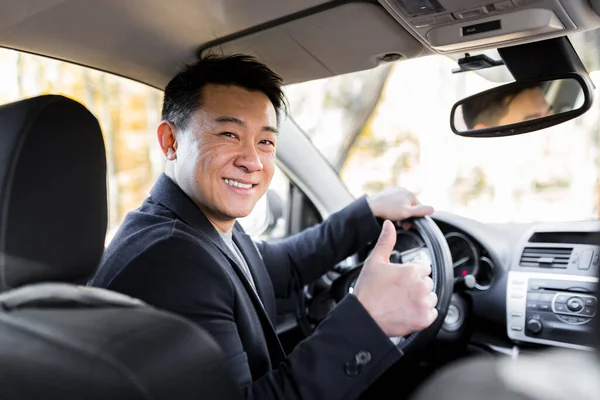 Man Driving Asian Car Wheel Looks Camera Smiles — Stock Photo, Image