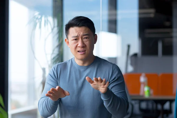 Portrait Serious Angry Employee Looking Camera Gesturing His Hands Asian — Stockfoto