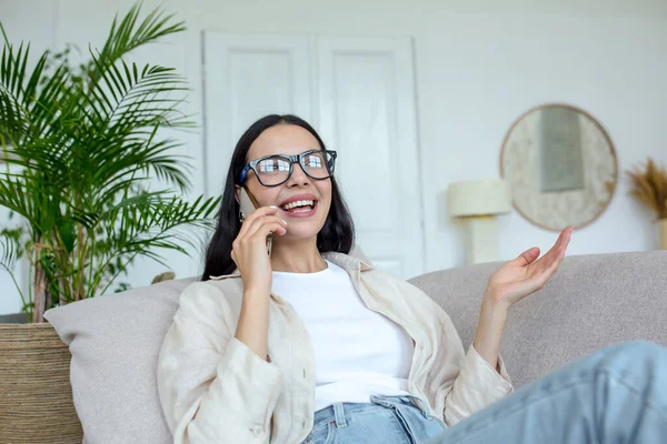 Happy Young Beautiful Woman Glasses Sitting Sofa Home Talking Phone — стоковое фото