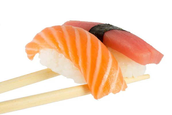 Isolated salmon and tuna nigiri on chopsticks and white background — Stock Photo, Image