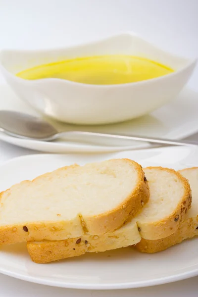 Sopu with bread in white dish with spoon — Stock Photo, Image