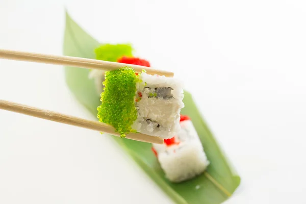 Sushi roll with green caviar — Stock Photo, Image