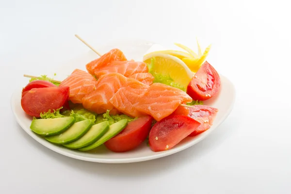 Raw salmon fillet on sticks with vegetables — Stock Photo, Image