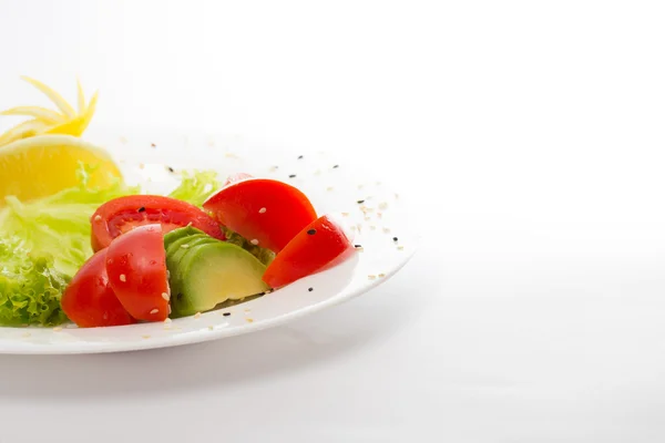 Raw vegetables. Avocado, tomato, salad. — Stock Photo, Image