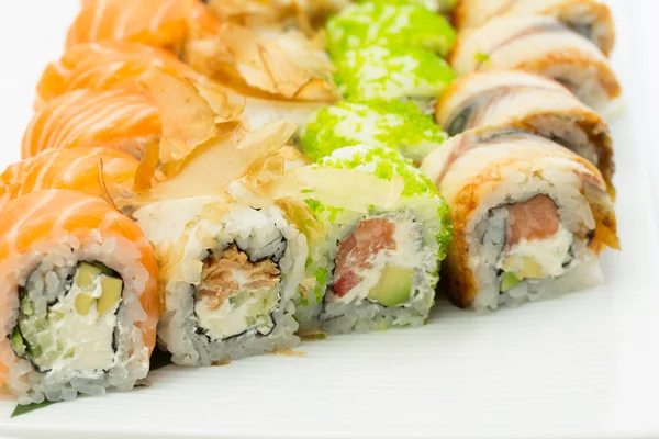 Sushi rolls on white plate — Stock Photo, Image