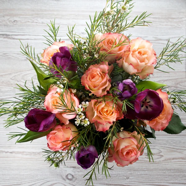 Bouquet of flowers on wooden background — Stock Photo, Image