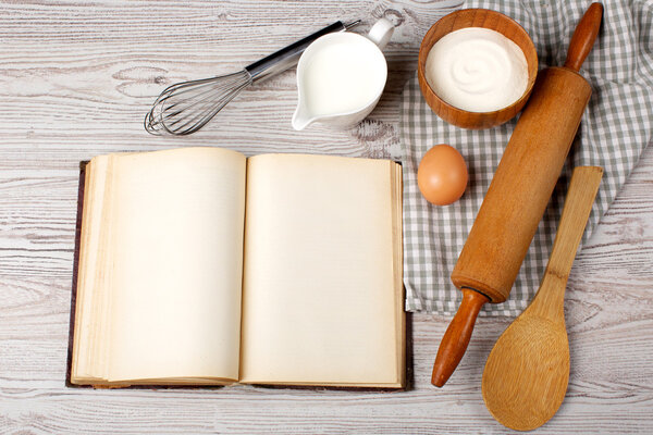 Cooking concept. Ingredients and kitchen tools with the old blan