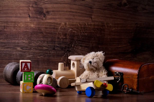 Collection of old wood children toys with teddy bear — Stock Photo, Image