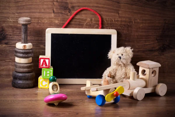 Collection of old wood children toys with teddy bear — Stock Photo, Image