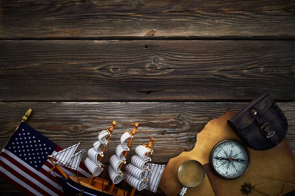 Columbus Day. Vintage discovery equipment with copy space on dark wooden background. — Stock Photo, Image