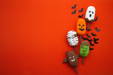 Turuncu arka planda cadılar bayramı karakterli bir dondurma seti. Cadılar Bayramı partisi geçmişi.