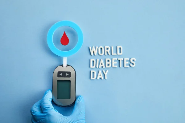World diabetes day concept. Red blood drop in circle with Blood glucose test strip and Glucose meter. Top view — Stock Photo, Image