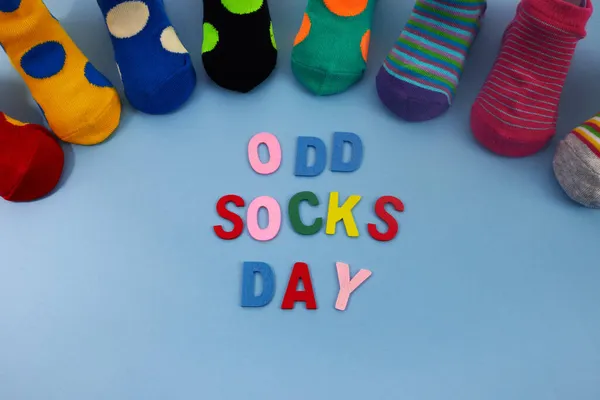 Odd Socks Day. Day lost socks, lonely socks on blue background. — Stock Photo, Image