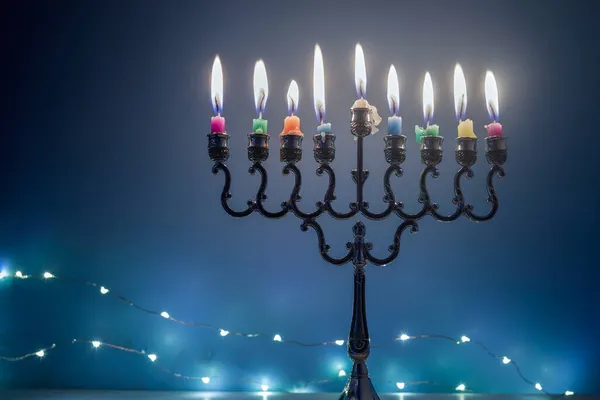 Jewish holiday Hanukkah background with menorah traditional candelabra and candles on blue background — Stock Photo, Image