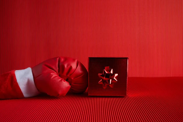 Boxing day shopping creative idea. Boxing glove with gift box. — Stock Photo, Image