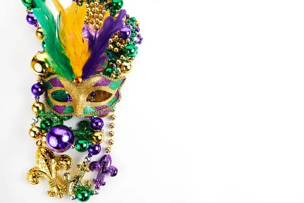Frame of Mardi Gras mask and beads isolated on white background. — Stock Photo, Image
