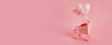 Pembe arka planda pembe alışveriş arabasında kalp şeklinde balonlar. Sezon satışı, bahar alışverişi konsepti. Sevgililer Günü.