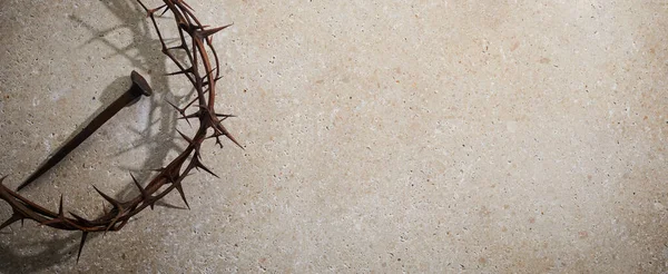 Easter concept. Crown of thorns with Nail on a stone background. — Stock Photo, Image