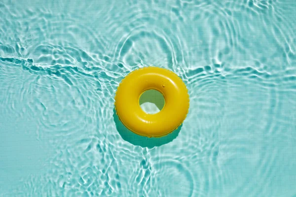 Swimming pool top view background. Water ring in water.
