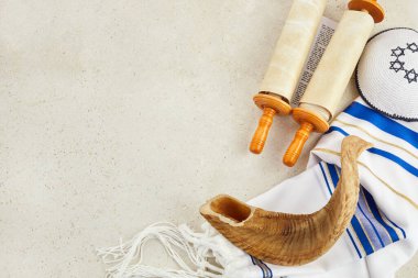 Yom kippur concept. Tallit, Thorah and Shofar jewish religious symbols.