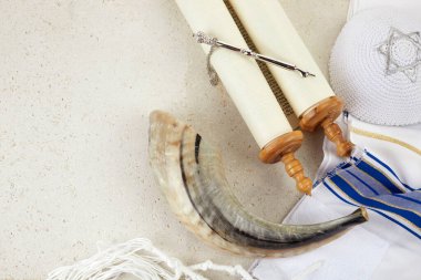 Yom kippur concept. Tallit, Thorah and Shofar jewish religious symbols.