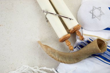 Yom kippur concept. Tallit, Thorah and Shofar jewish religious symbols.