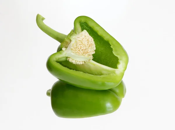 Green pepper incision on the mirror — Stock Photo, Image