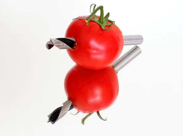 Drilled tomato on the mirror — Stock Photo, Image