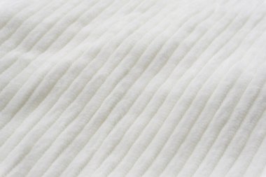 Beyaz kadife kumaş dokusu yakın.