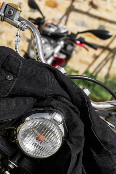 Black Denim Jacket Thrown Handlebars Motorcycle Close — Fotografia de Stock